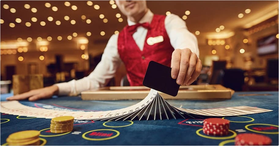 Dealer shuffles cards at a casino table